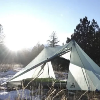 Lightweight backpacking tent in snowy woods.